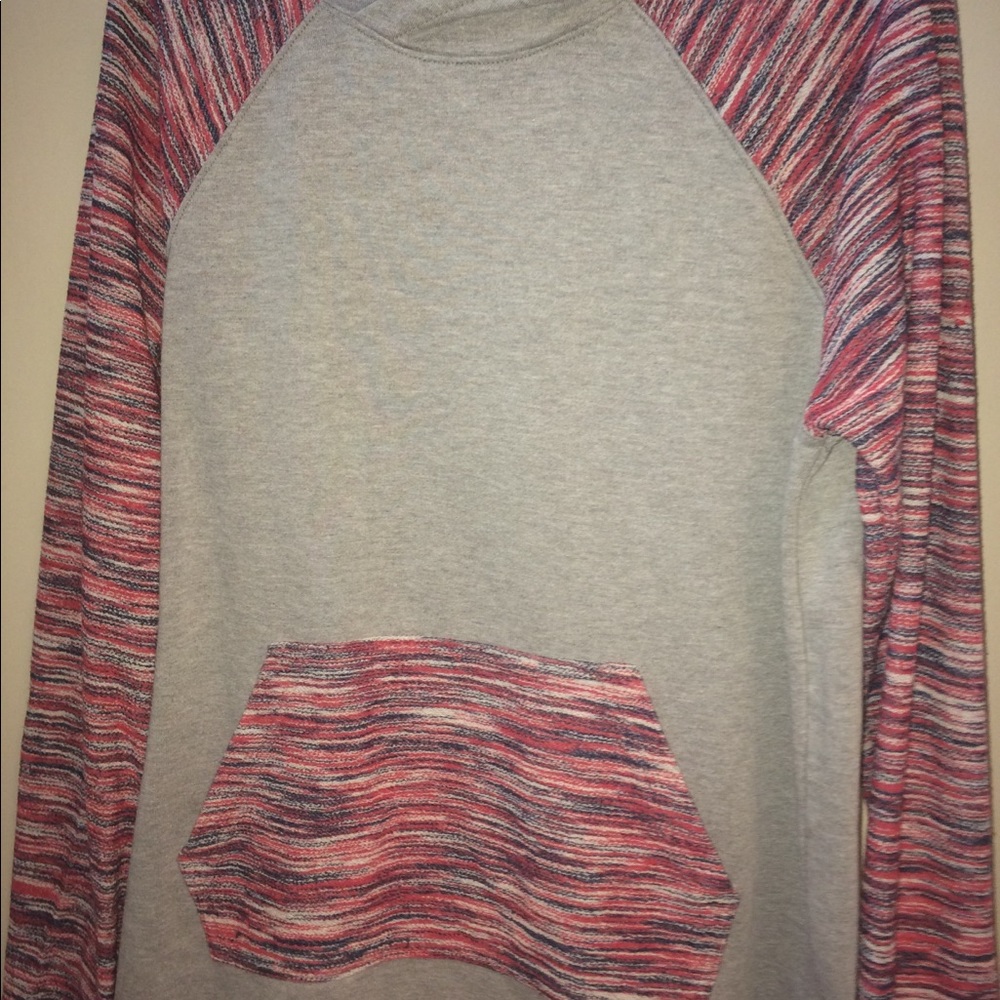 A red, blue, gray, and white hoodie.